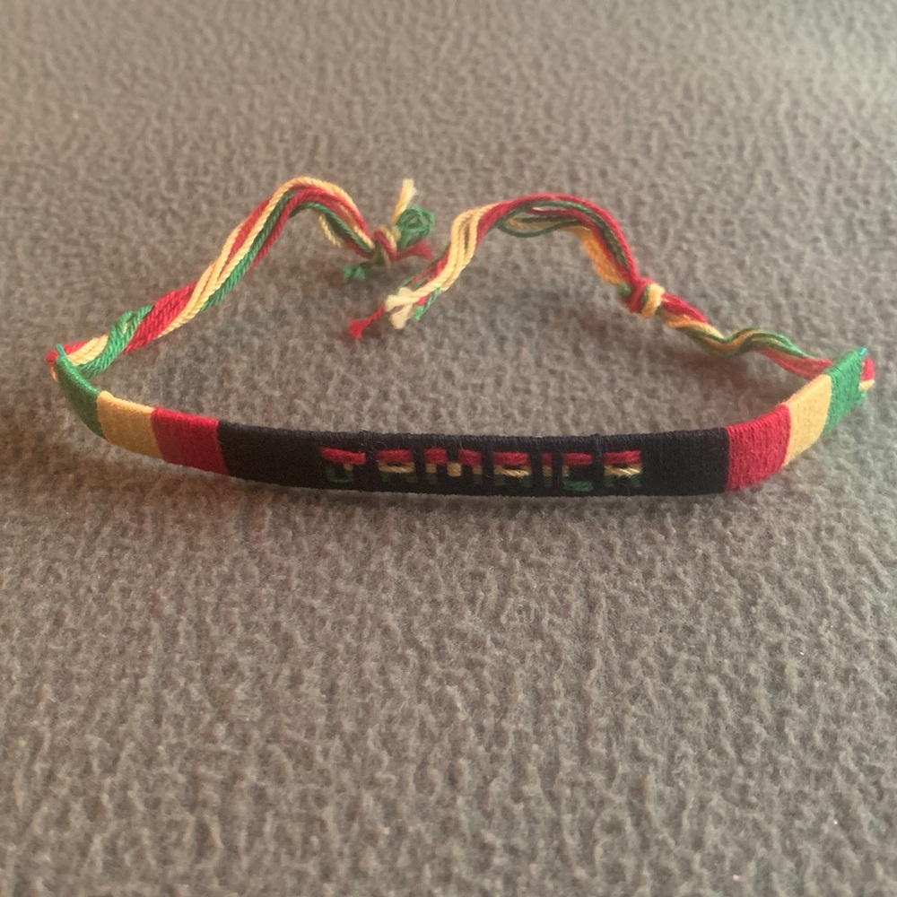 New Jamaica green, yellow, red and black string bracelet. Approx 11 1/2”
